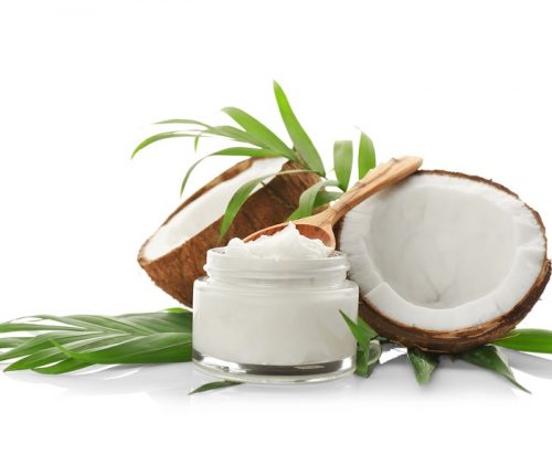 Composition with coconut oil in jar on white background